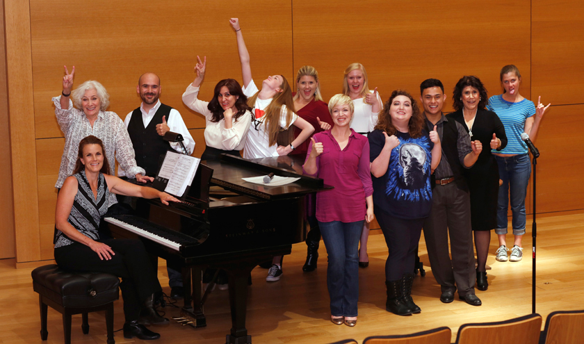 Betty Buckley’s master class students gathered around a grand piano